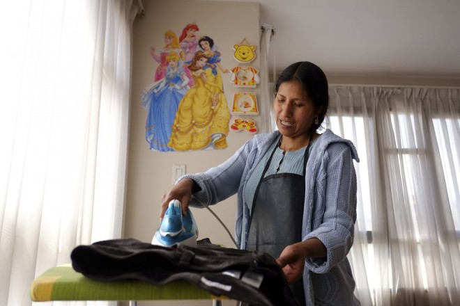 Condori irons clothes in La Paz