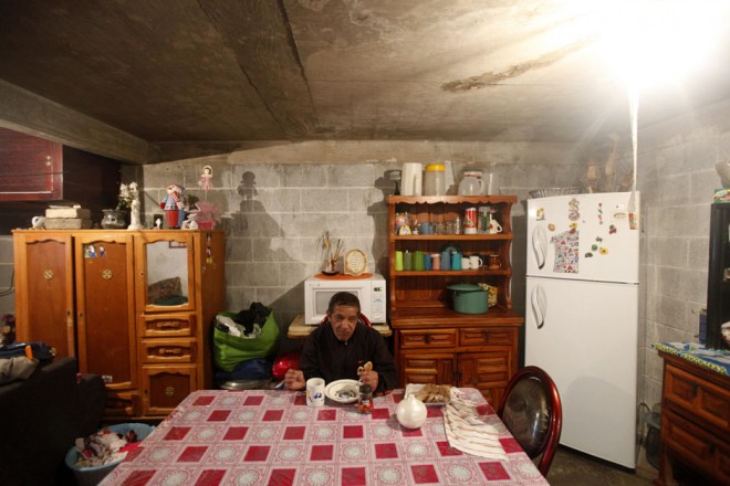 Jorge eats at his home on the outskirts of Mexico City